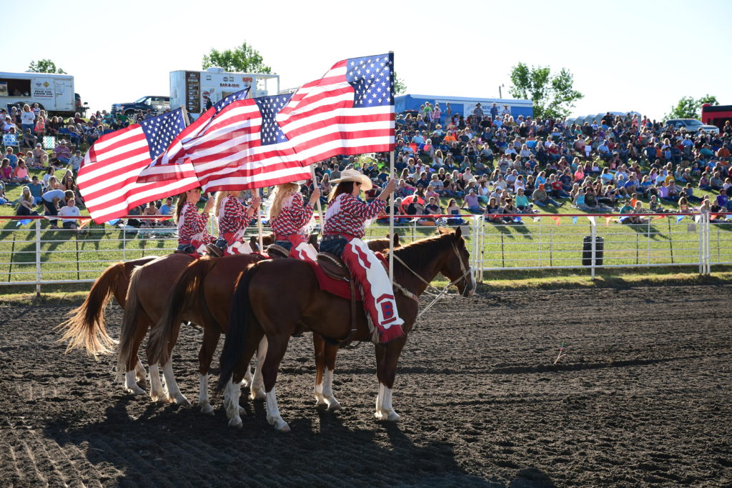 Flag Girls during grand entry include Rodeo Co-Chair Amy Anderson_photo credit Gretchen Kirchmann