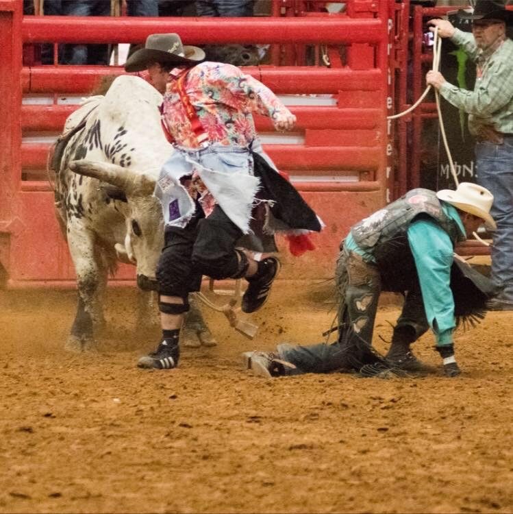 Michael Early protecting a bullrider.